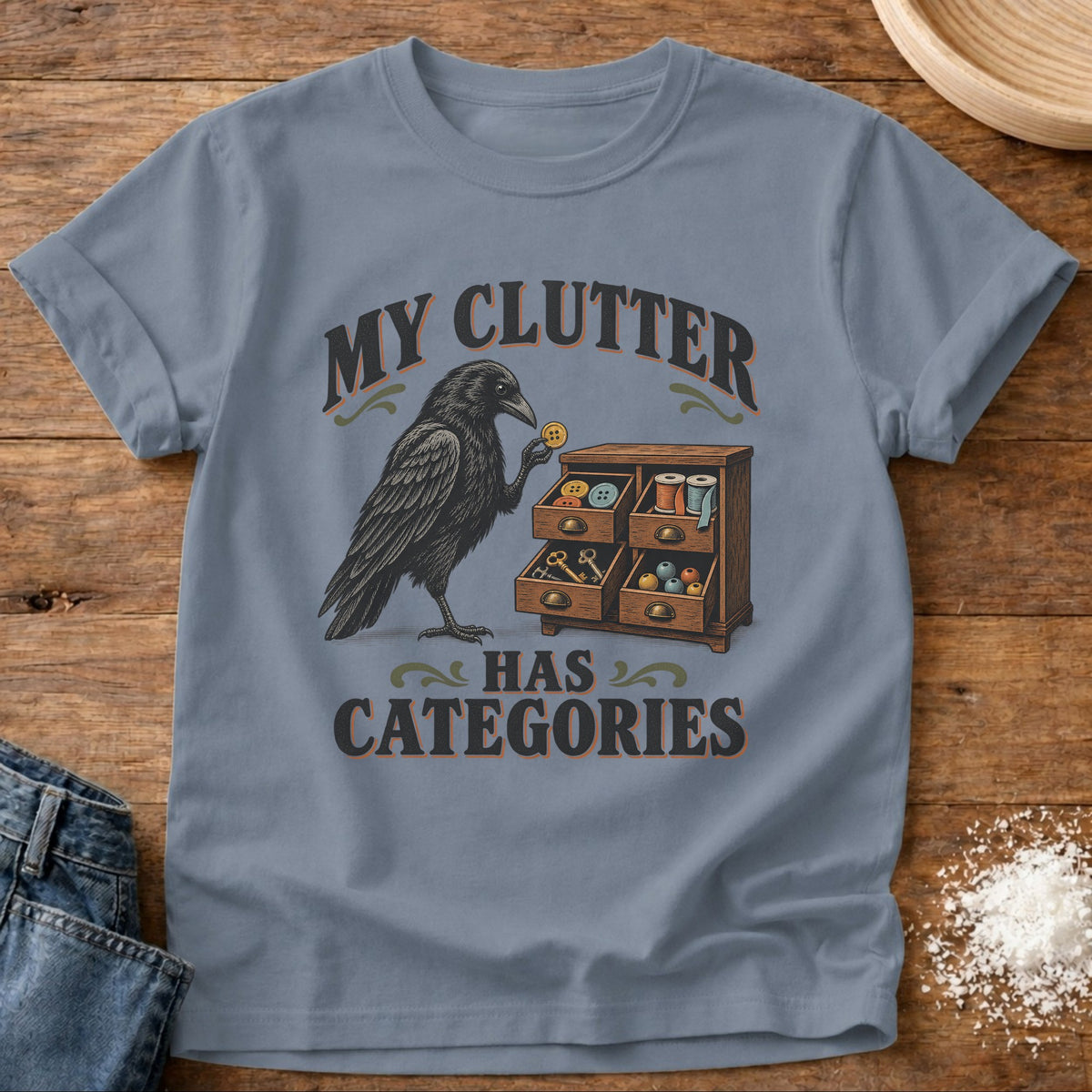 Knead More Fun Clutter Categories Crow graphic t-shirt in Blue Jean