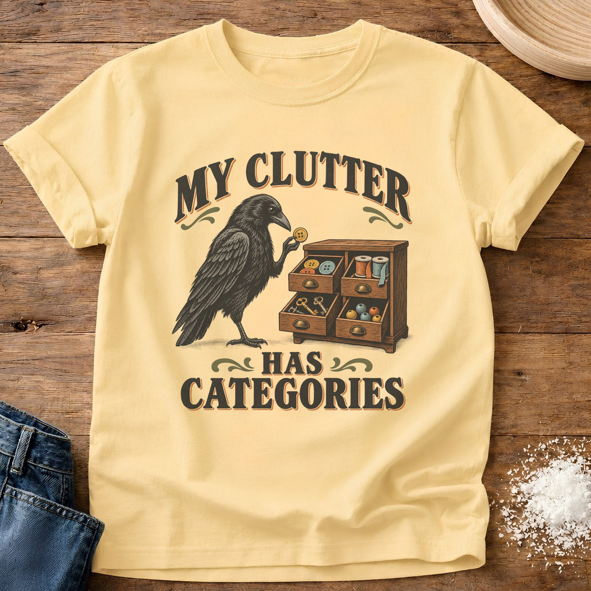Knead More Fun Clutter Categories Crow graphic t-shirt in Butter