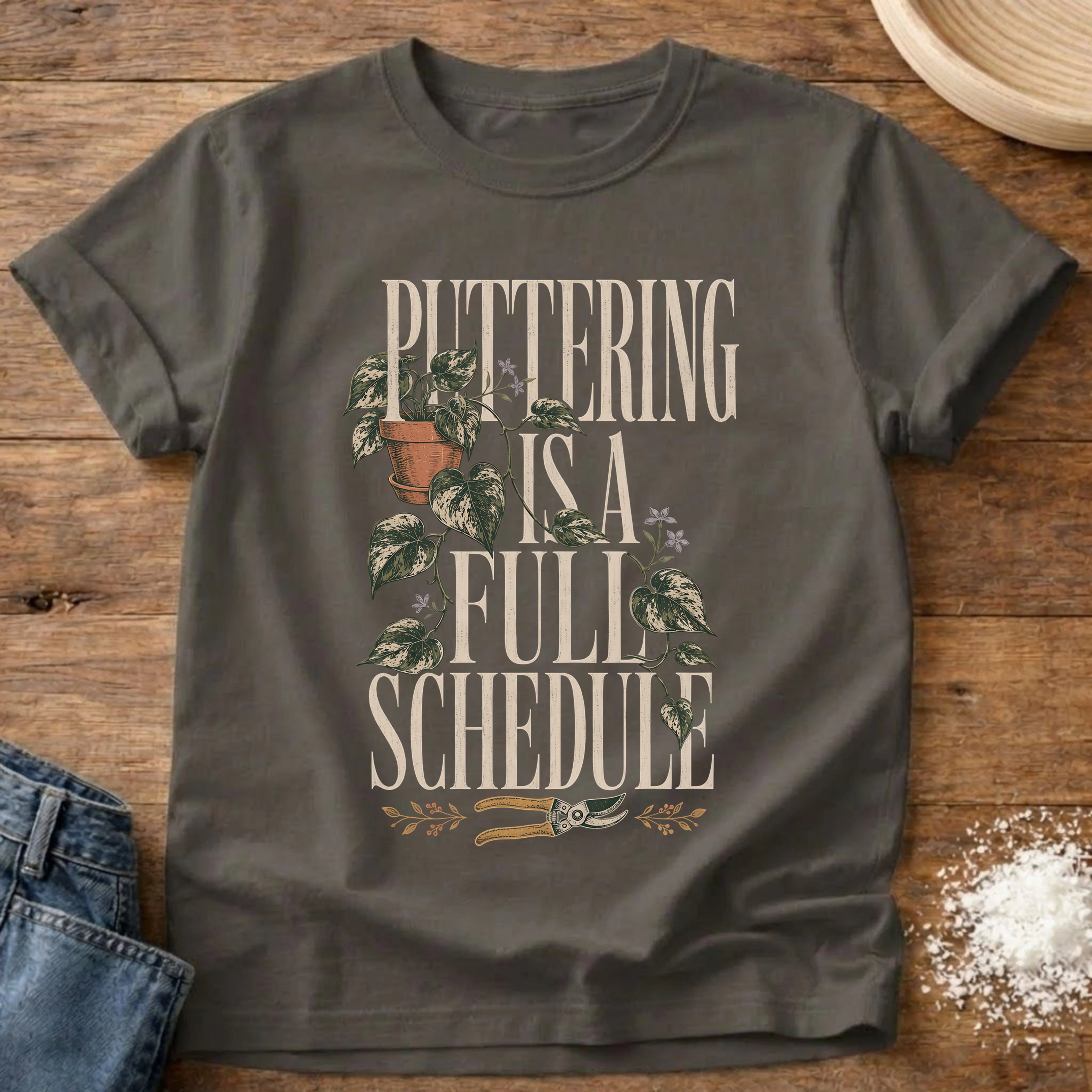 Knead More Fun puttering schedule garden t-shirt in Pepper